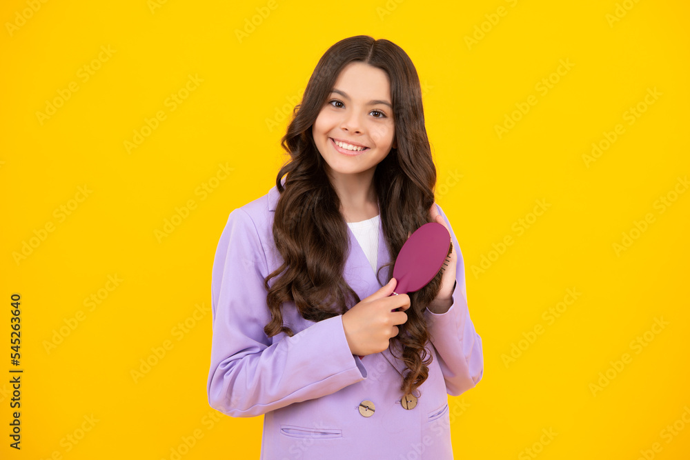 Teenage girl with brush combing hair. Girl taking hairstyle. Child brushing hair with comb, kids haircare. Happy face, positive and smiling emotions of teenager girl. Teenage girl with brush combing hair. Girl taking hairstyle. Child brushing hair with comb, kids haircare. Happy face, positive and smiling emotions of teenager girl.