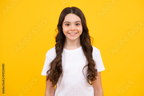 Happy teenager, positive and smiling emotions of teen girl. Pretty teenage girl in studio. Child girl portrait.