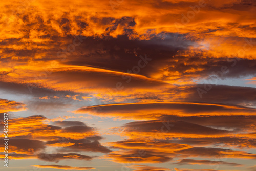 Sky with spectacular lenticular clouds at dawn