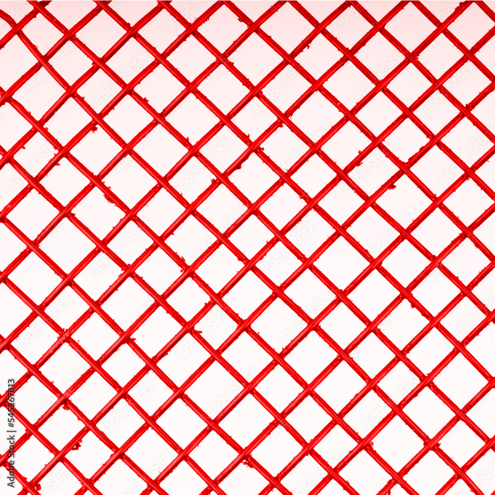 The texture in the form of a red metal mesh on a white background. Closeup The texture in the form of a red metal mesh on a white background. Closeup