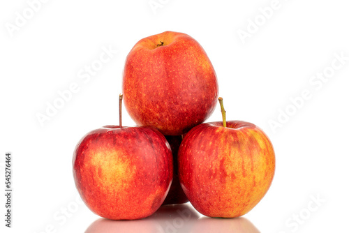 Three red ripe apples, macro, isolated on white background.