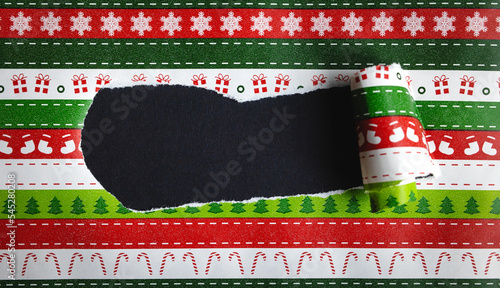 Torn christmas wrapping paper with copy space