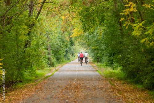 Bicycle Riders On The Local Trail In Fall