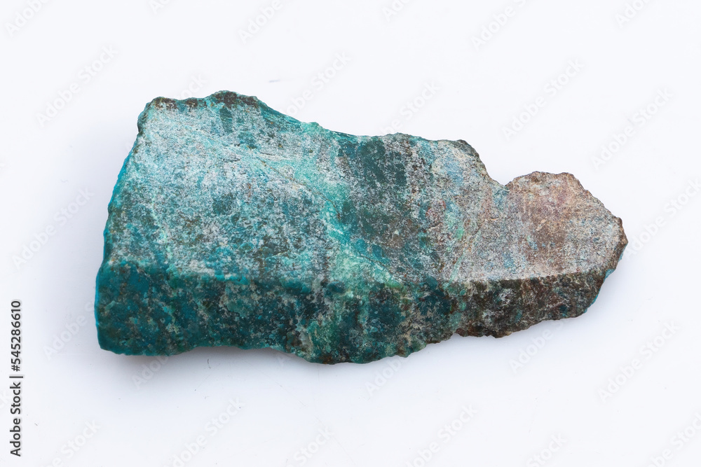 Natural Chrysocolla stone on a white background. Mineral of blue and bluish-green color on a white background Natural Chrysocolla stone on a white background. Mineral of blue and bluish-green color on a white background