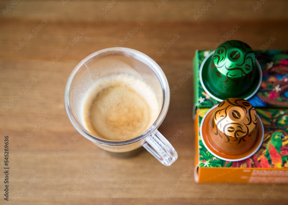MOSCOW, RUSSIA - FEBRUARY 17, 2018: Cup of Coffee Nespresso Capsules Boxes  Limited Collection Nespresso Robusta Uganda Arabica Ethiopia Harrar Coffee  on Wooden Background Natural Light Selective Focus Stock Photo | Adobe Stock
