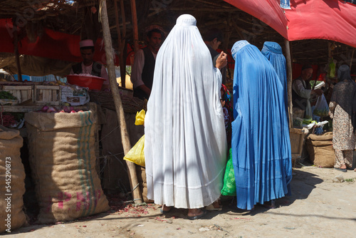 Afghan women wearing burka at the market, Andkhoy, Faryab Province, Northern Afghanistan photo