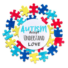 Autism Awareness campaign. Text, Accept, Understand, Love in round circle frame with puzzle pieces around. Social Health Care campaign visual materials on inclusivity of people with Autistic disorder.
