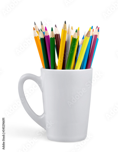 Close up colour pencils in white ceramic cup isolated on white background