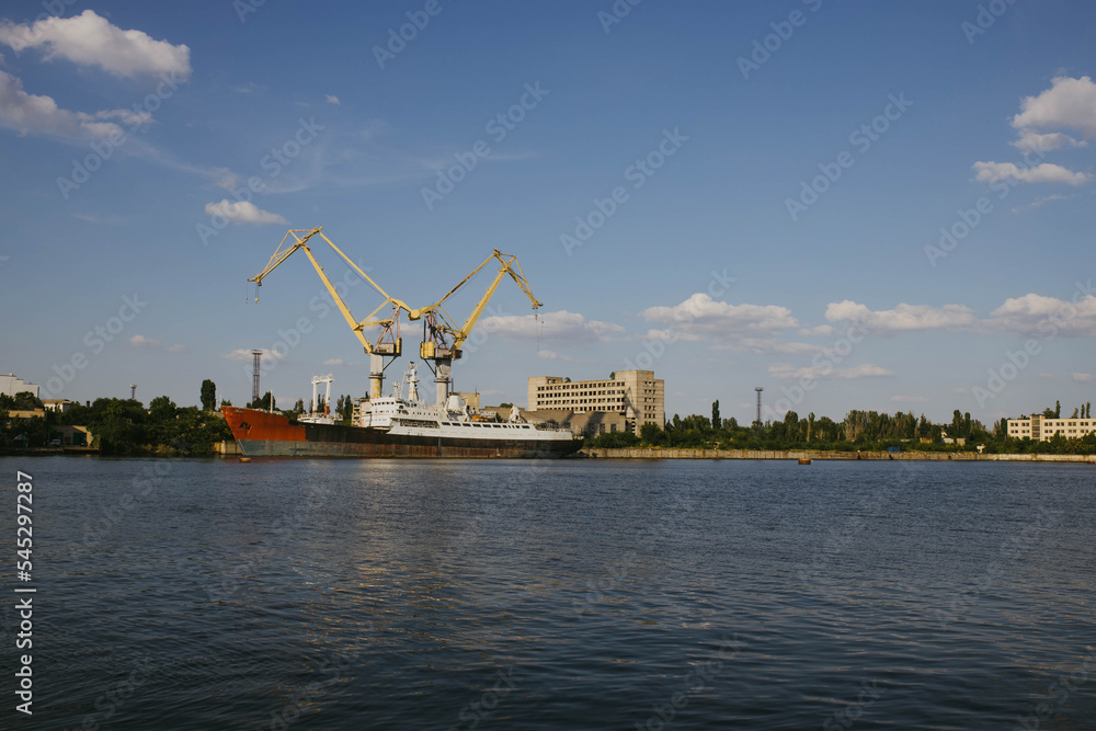 Mykolaiv, Ukraine - . September 4, 2021. Cranes in the port where ships can be repaired. View from the riverside