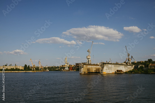 Mykolaiv, Ukraine - . September 4, 2021. Cranes in the port where ships can be repaired. View from the riverside