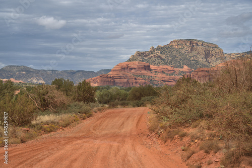 Red dirt road leading to a historic cliff dwelling site called Honanki © ronm