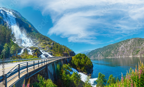 Summer mountain Langfossen waterfall on slope (Etne, Norway). photo