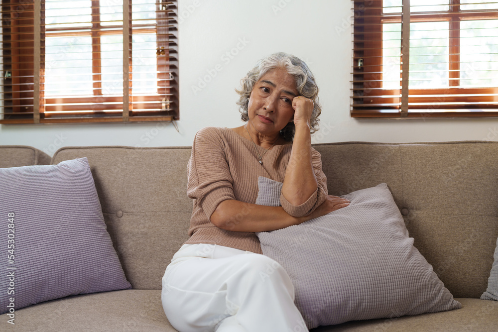 Portrait of a senior man thinking about something, feeling sad, sitting on sofa, asian people. Portrait of a senior man thinking about something, feeling sad, sitting on sofa, asian people.