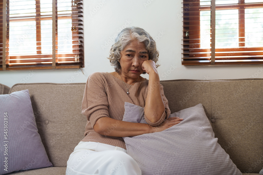 Portrait of a senior man thinking about something, feeling sad, sitting on sofa, asian people. Portrait of a senior man thinking about something, feeling sad, sitting on sofa, asian people.