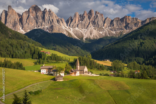 St. Magdalena with famous church in Val di Funes at sunset, Dolomites , Italy