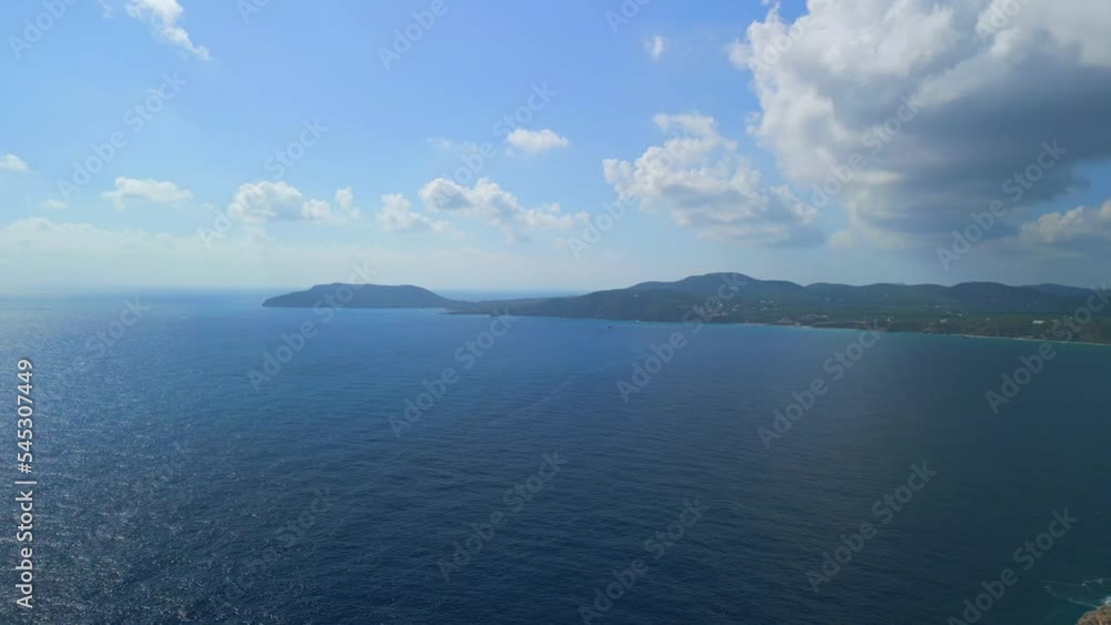 from offshore view to the island of Ibiza. Buttery soft aerial view flight from offshore view to the island of Ibiza. Buttery soft aerial view flight