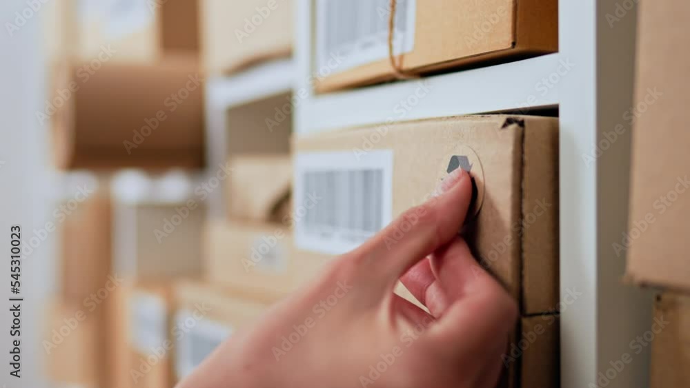 Sticking a recycle sign arrow on a medium-sized business cardboard box, Cardboard box parcel cargo warehouse, an employee marks a shipping box with a recycle sign
Sticking a recycle sign arrow on a medium-sized business cardboard box, Cardboard box parcel cargo warehouse, an employee marks a shipping box with a recycle sign