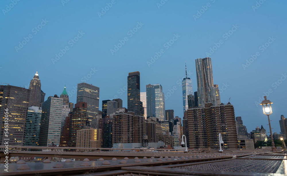 Evening panorama of New York skyscrapers, view from the Brooklyn Bridge