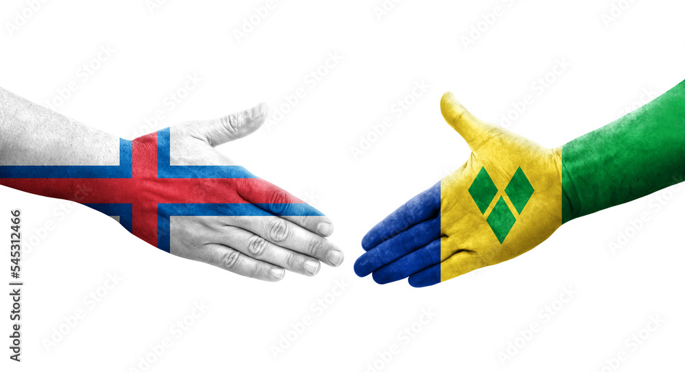 Handshake between Saint Vincent Grenadines and Faroe Islands flags painted on hands, isolated transparent image. Handshake between Saint Vincent Grenadines and Faroe Islands flags painted on hands, isolated transparent image.