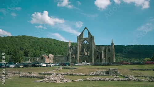 Time lapse of clouds over ancient ruins of Tintern Abbey, Wales, UK photo