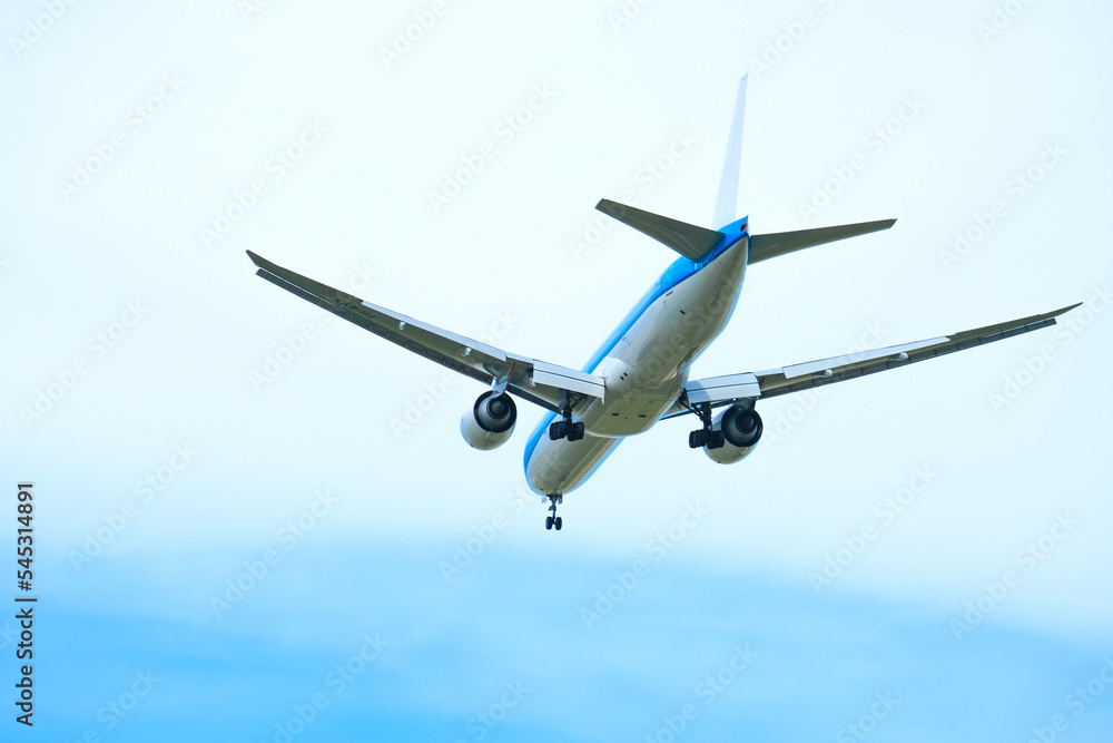 Naklejka premium Airplanes, passengers flying in the sky, preparing to land at the airport