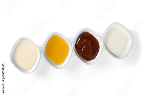 the various barbecue sauces in ceramic bowls