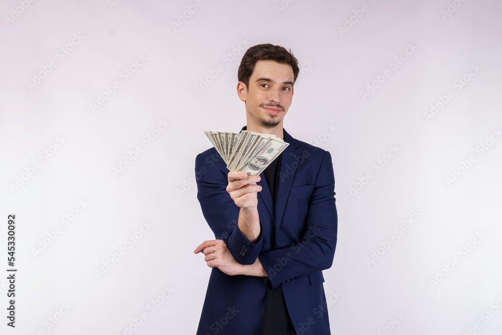 Portrait of a cheerful man holding dollar bills over white background Portrait of a cheerful man holding dollar bills over white background
