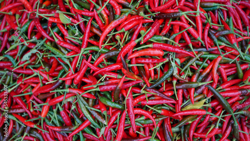 Hot chilli peppers pattern texture background. Close up background landscape of hot chili peppers. © somchai