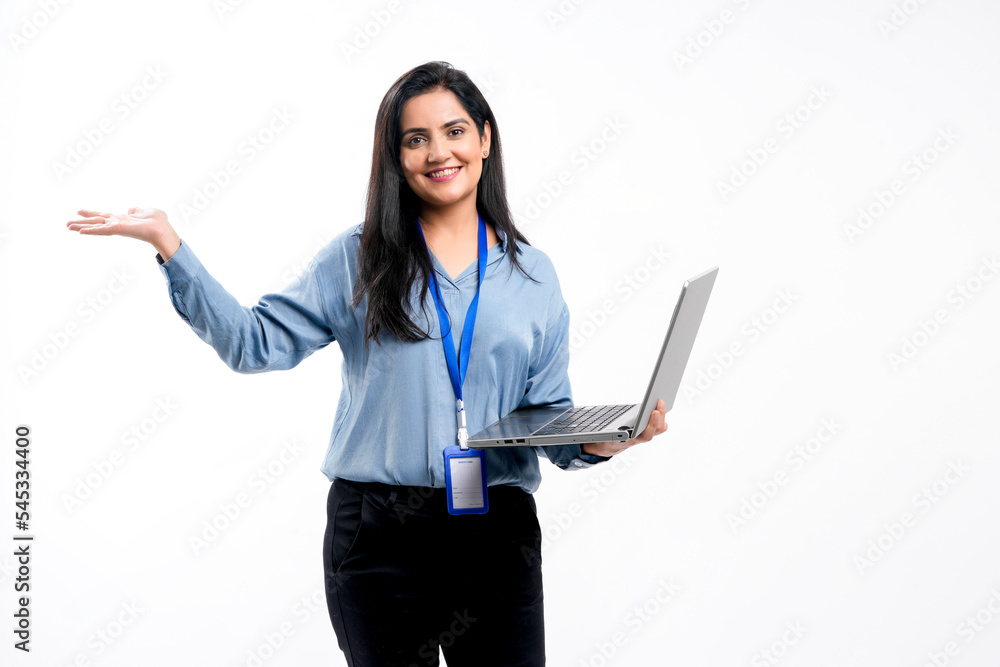 Indian businesswoman or employee using laptop on white background. Indian businesswoman or employee using laptop on white background.