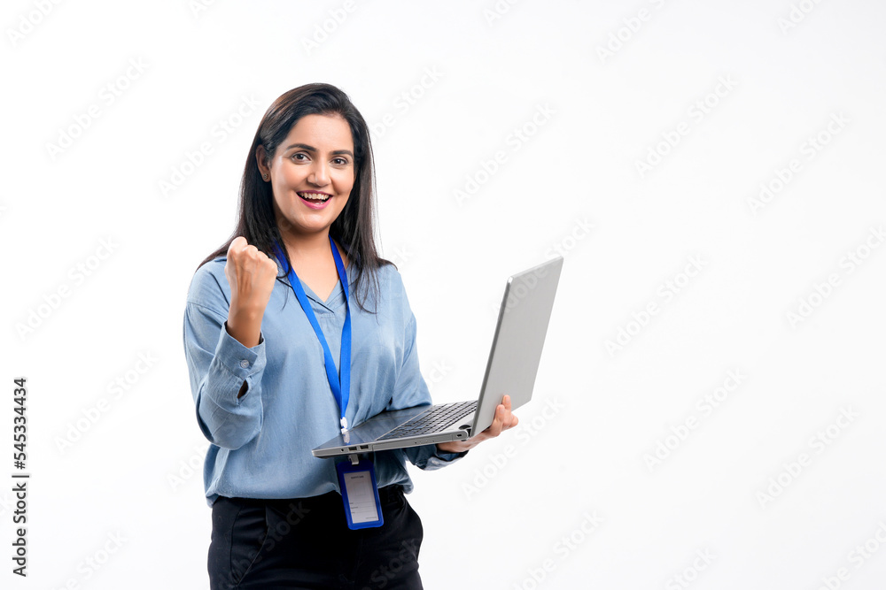 Indian woman employee using laptop on white background. Indian woman employee using laptop on white background.