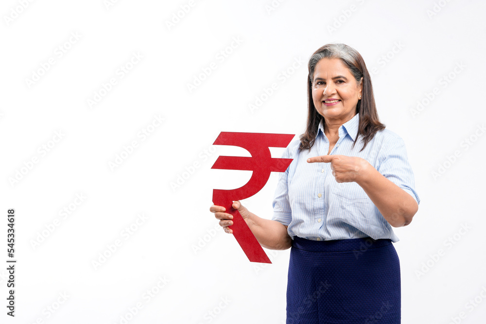Indian senior lady holding rupees symbol in hand on white background. Indian senior lady holding rupees symbol in hand on white background.