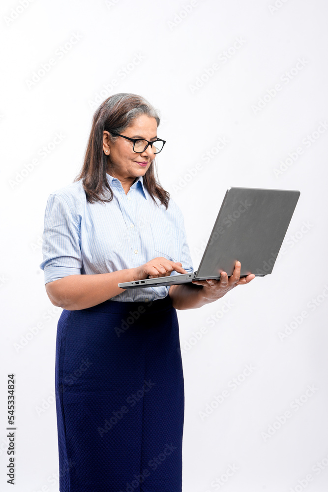 Indian businesswoman or employee using laptop on white background. Indian businesswoman or employee using laptop on white background.