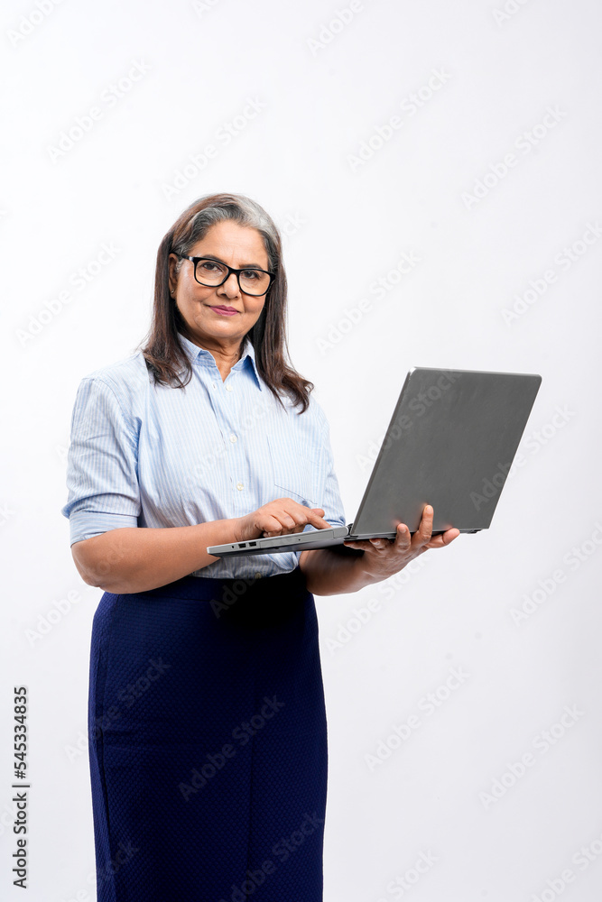 Indian businesswoman or employee using laptop on white background. Indian businesswoman or employee using laptop on white background.
