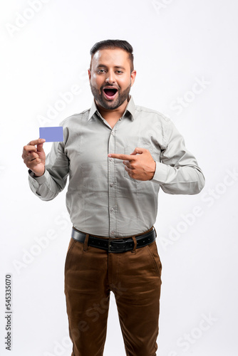 Indian man showing card on white background © Niks Ads