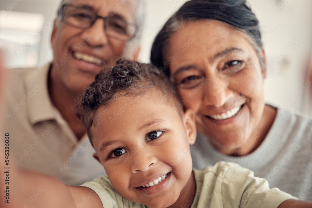 Selfie, smile and boy with grandparents for a portrait, happy and relax in family home together. Love, care and child with a senior man and woman for a photo, bonding and happiness as a happy family Selfie, smile and boy with grandparents for a portrait, happy and relax in family home together. Love, care and child with a senior man and woman for a photo, bonding and happiness as a happy family