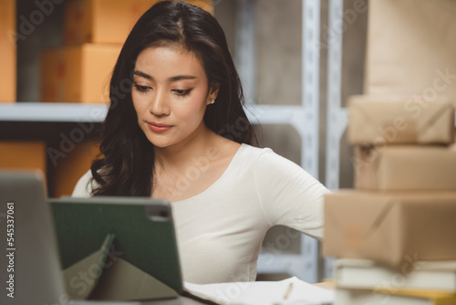 Young woman working at home...