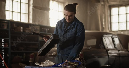 Wallpaper Mural Male technician cleaning engine part Torontodigital.ca