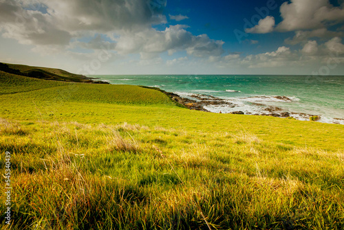 Slow Motion blur on the clouds taken with slow shutter for this images to see movement of the clouds with beautiful landscape at Katiki Point Lighthouse photo