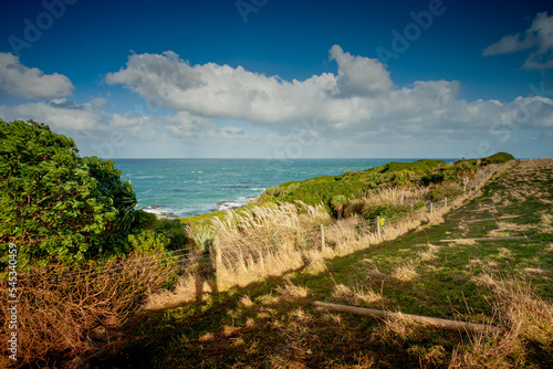 Slow Motion blur on the clouds taken with slow shutter for this images to see movement of the clouds with beautiful landscape at Katiki Point Lighthouse photo