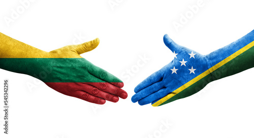 Handshake between Solomon Islands and Lithuania flags painted on hands, isolated transparent image.