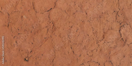 Dark brown cracked terracotta texture background