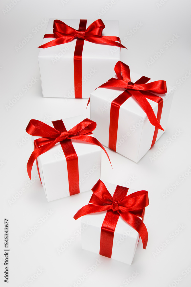 Obraz premium Gift boxes decorated with red ribbons.