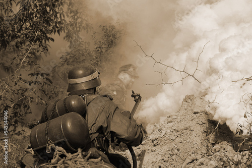  Person in German WW2 military uniform with flame-thrower. Historical military reenacting in Kiev