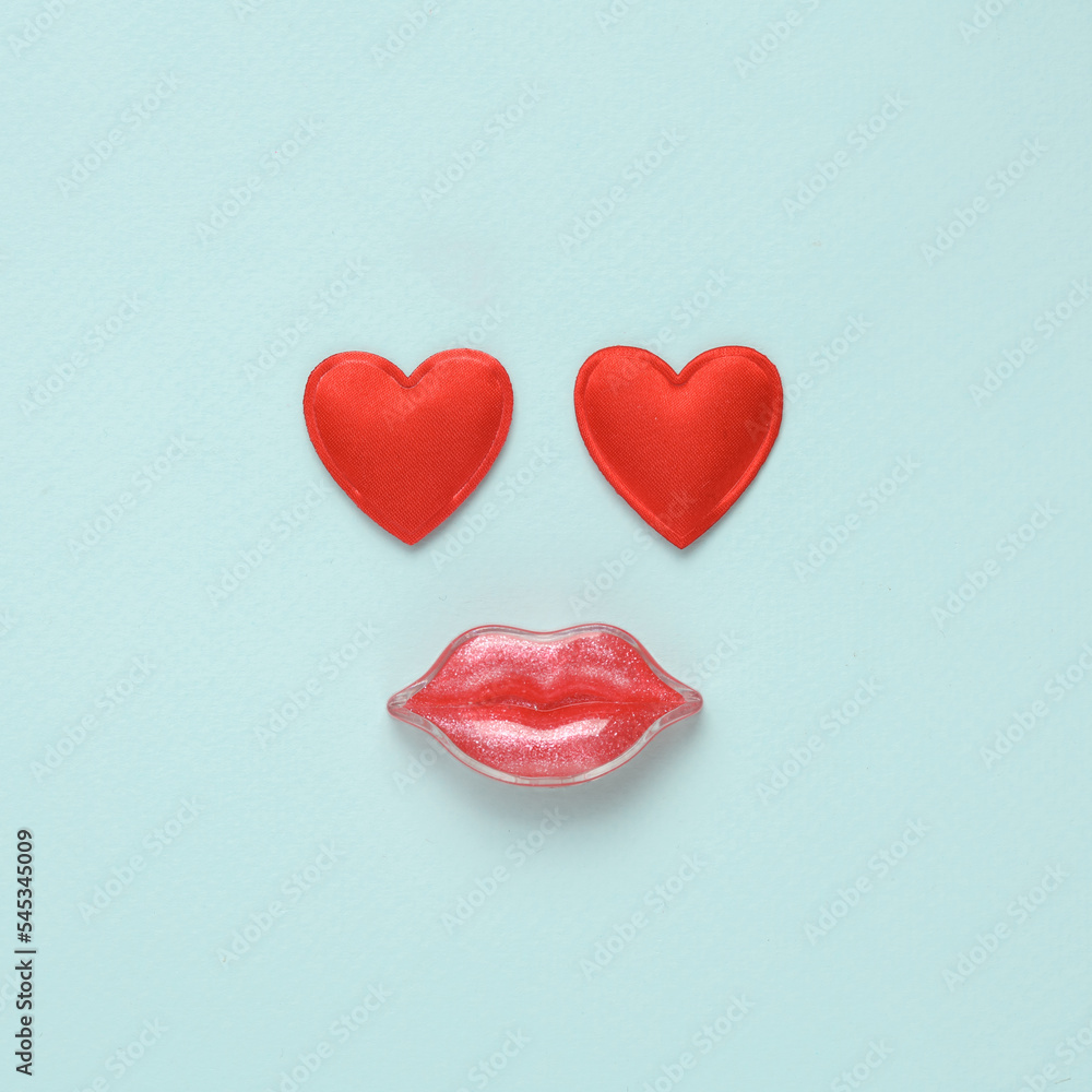 Lips with hearts on a blue background. Beauty concept. Creative idea