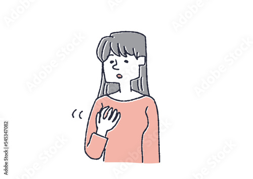 乳房にしこりがないか触って調べている女性