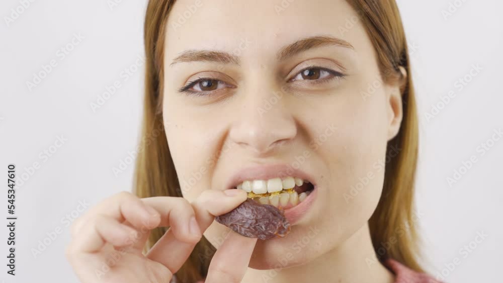 Woman eating fresh dates in close-up. Dry fruits.
Close-up woman eats fresh dried dates.
Woman eating fresh dates in close-up. Dry fruits.
Close-up woman eats fresh dried dates.