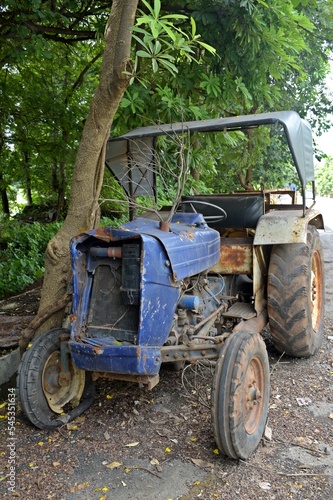 old rusty abandoned blue tractor 