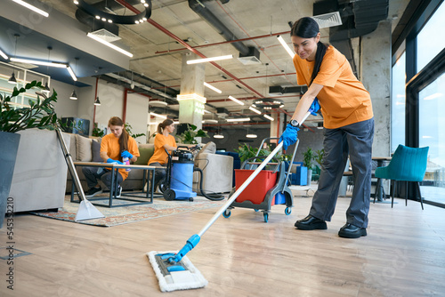 Cleaning company employees are dressed in work clothes