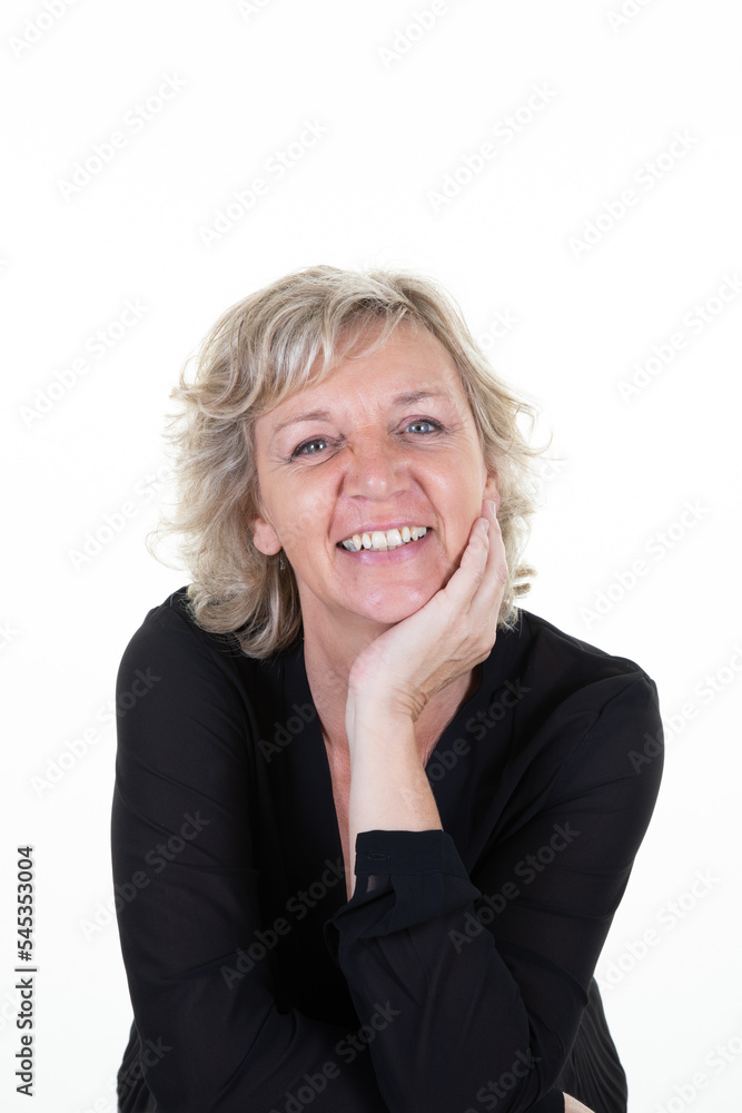 senior blonde woman 60 with blond mature hair posing in studio with hand on chin face 50 portrait senior blonde woman 60 with blond mature hair posing in studio with hand on chin face 50 portrait