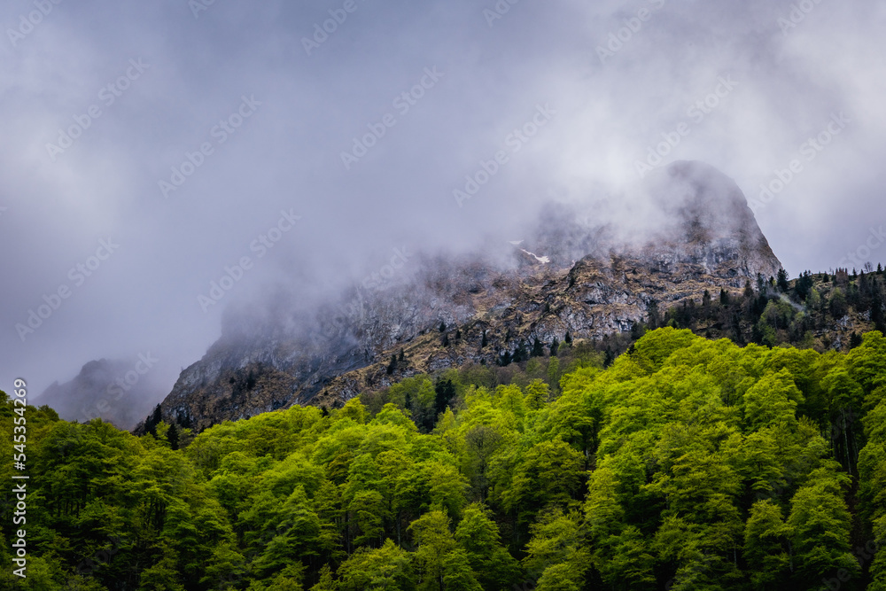 Mountains hidden by clouds in the French Pyrenees near Bethmale lake (Ariege)